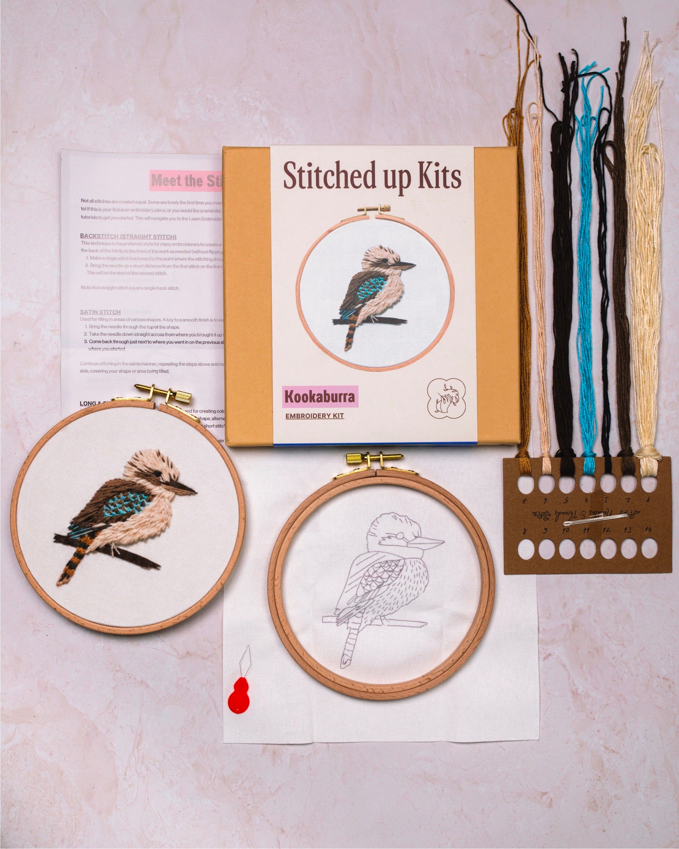 Embroidery kit with kookaburra design on a textured surface