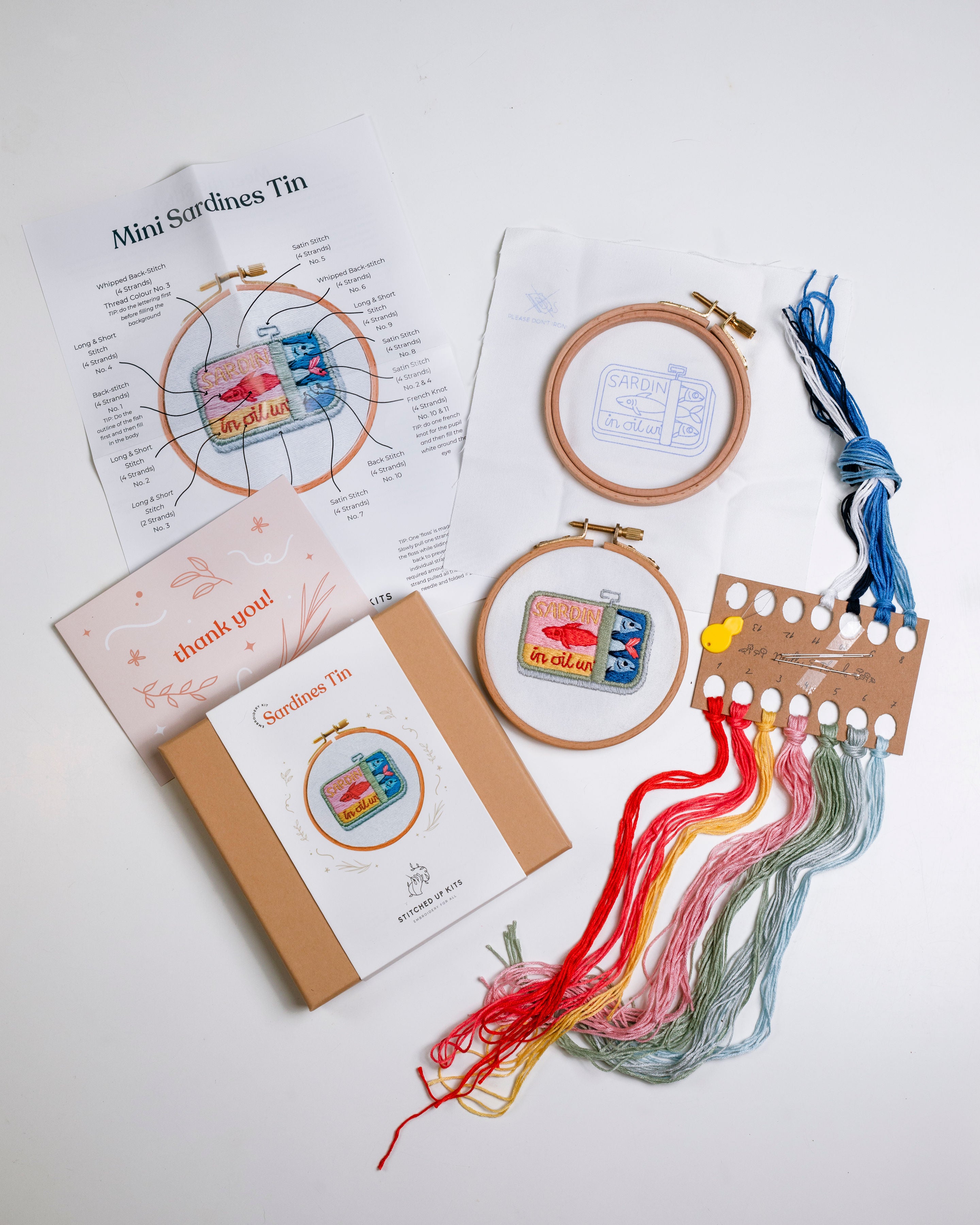 Mini Sardines embroidery kit with threads, hoops, and instructions on a white background
