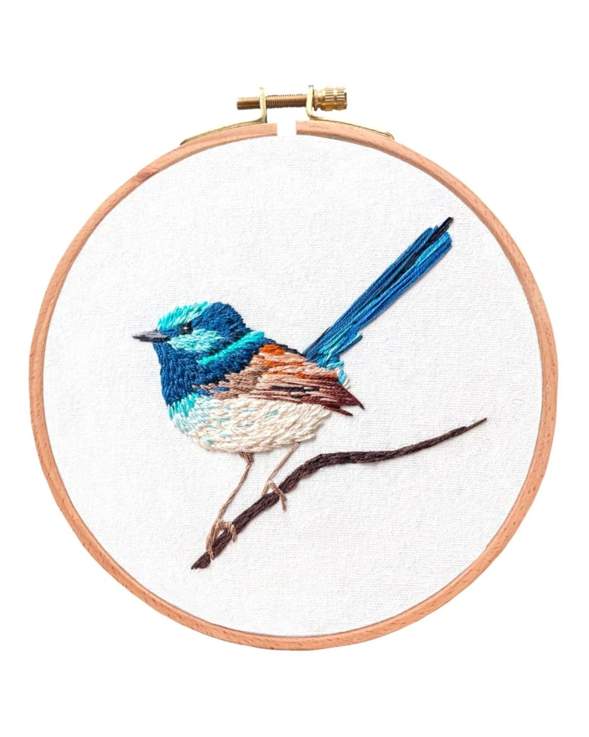 Blue Wren Embroidery Kit featuring detailed bird design in wooden hoop on white fabric with turquoise and brown stitching