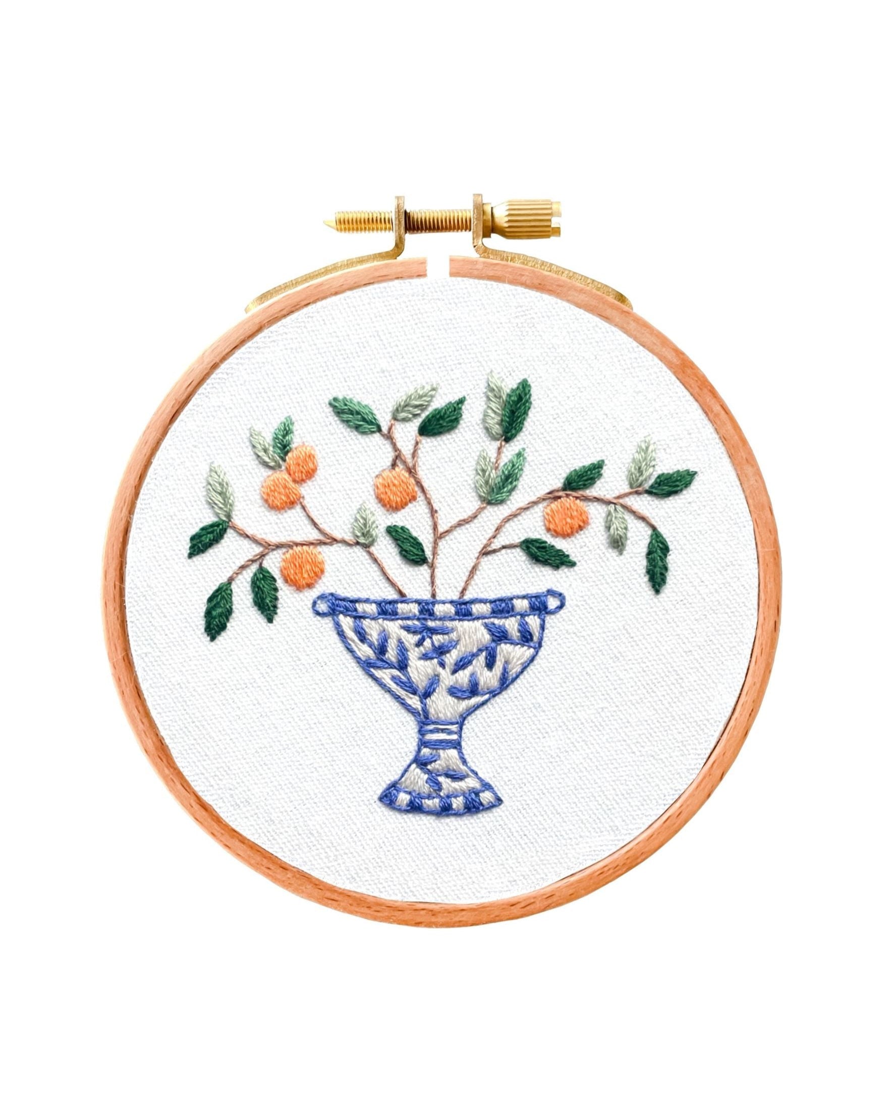 Mini Italian Vase embroidered design with blue and white decorative bowl holding orange fruit branch and green leaves