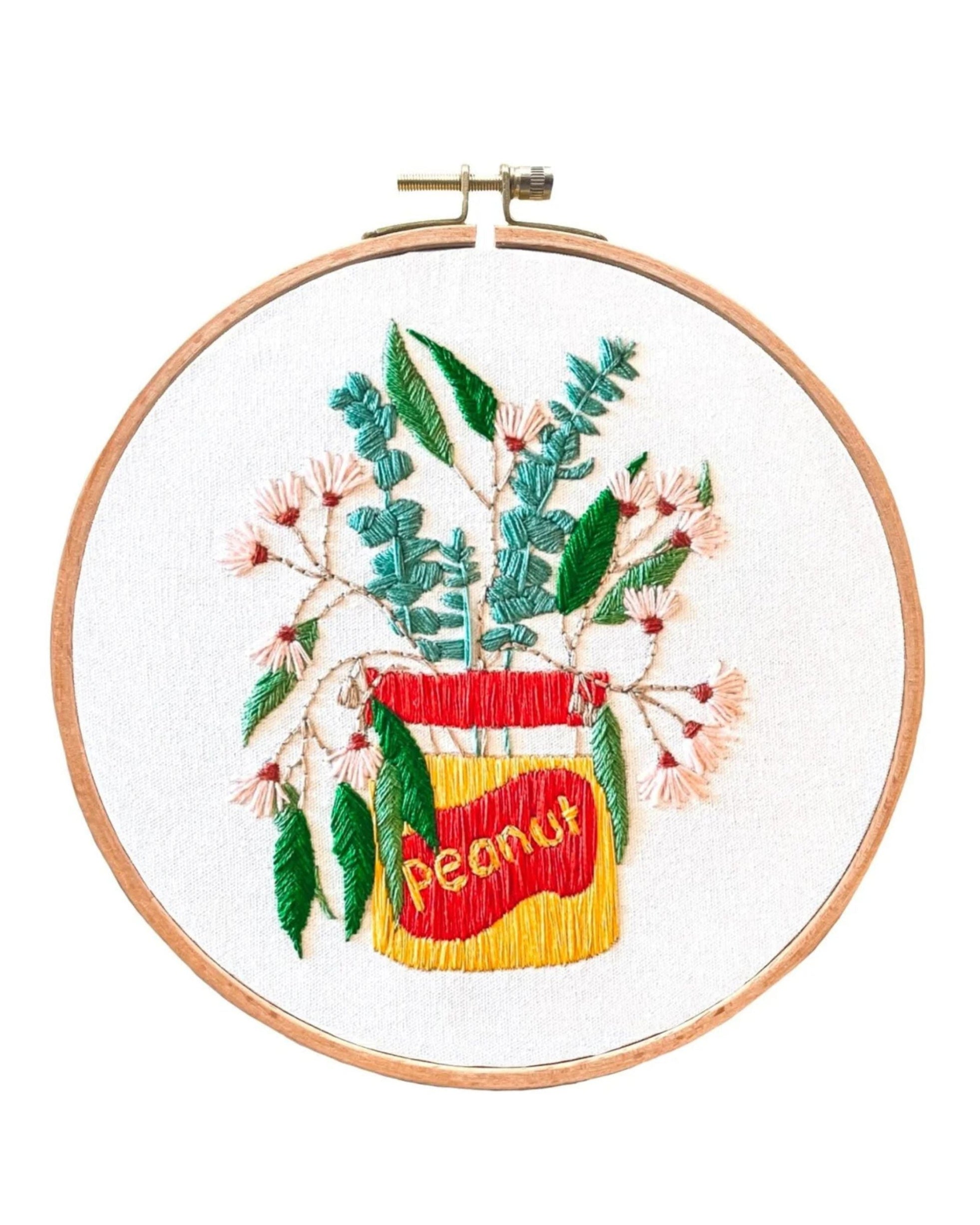 Peanut Native Gum Leaves embroidery hoop art with green leaves and pink flowers in a peanut jar design.